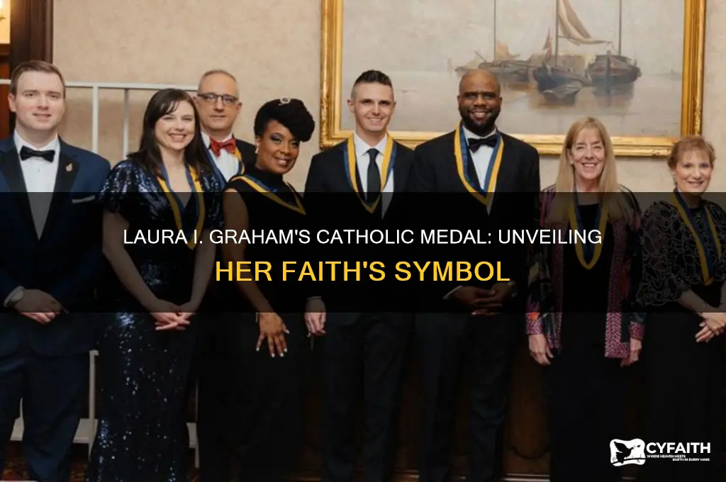 what kind of catholic medal does laura i graham wear