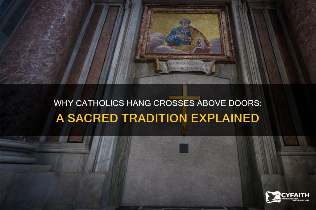 why catholics hang crosses above doors