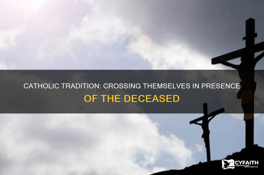why do catholics cross themselves around the dead