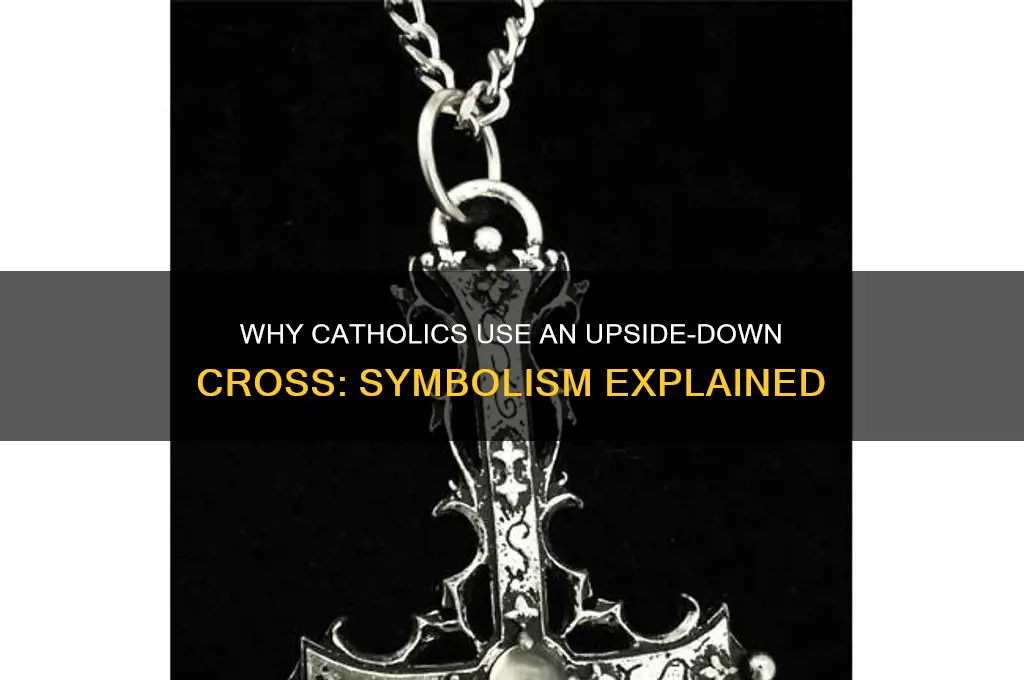 why do catholics do an upside dowbvcross