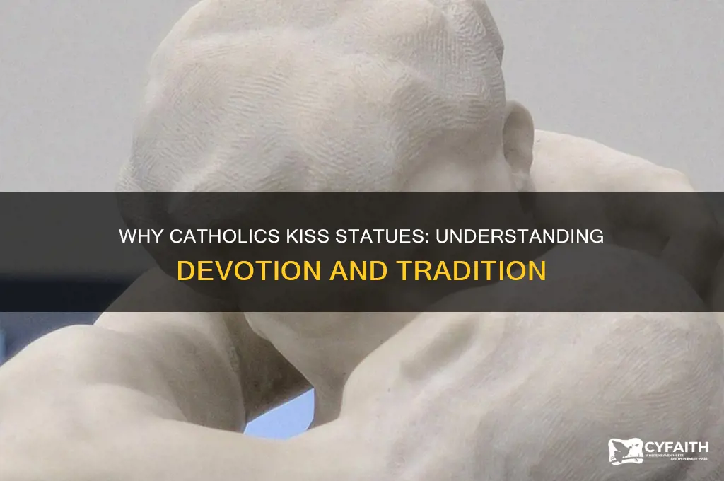 why do catholics kiss statues