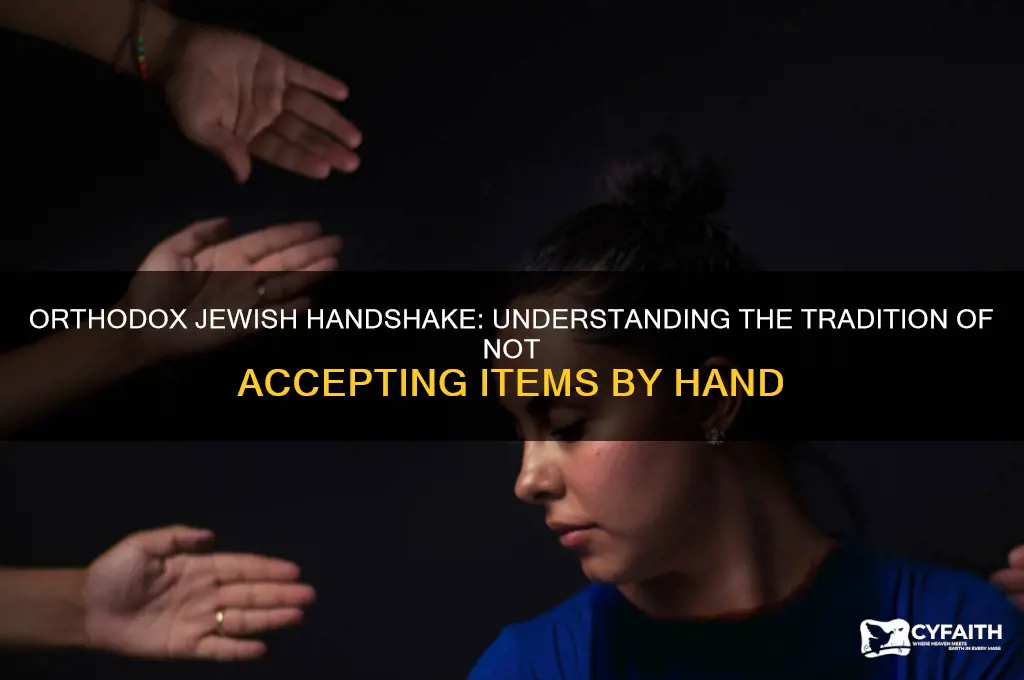 why do orthodox jews do not accept items by hand