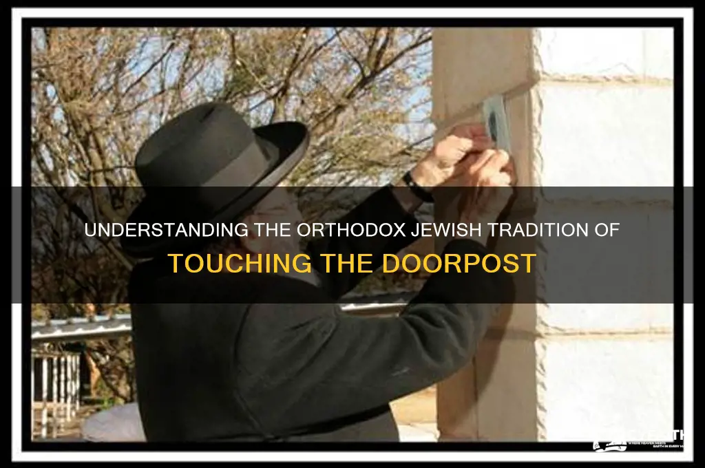 why do orthodox jews touch the door